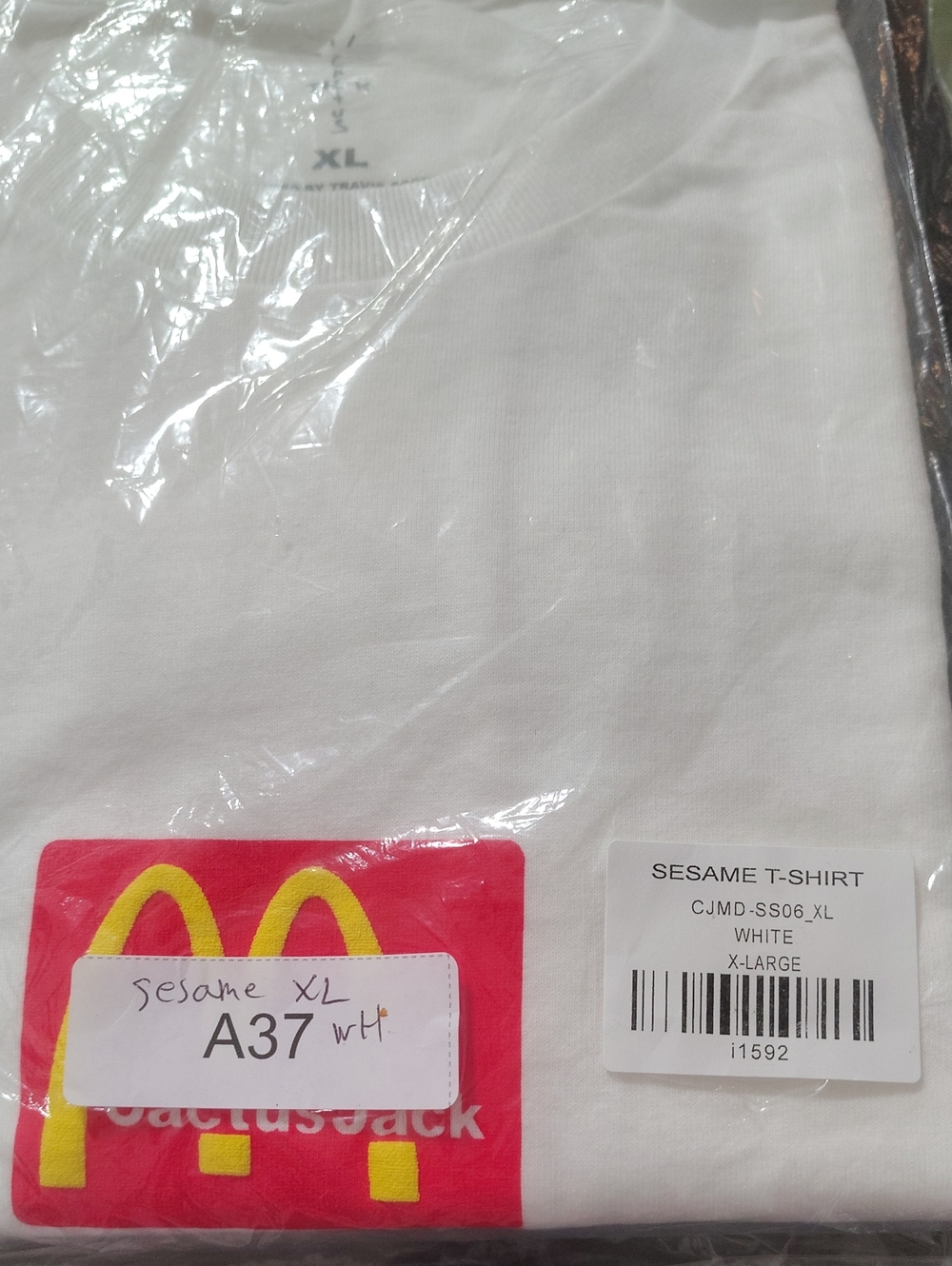 Cactus Jack by Travis Scott White Short Sleeve Tee with Yellow & Red Logo
